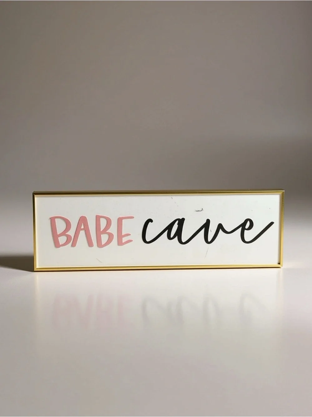Babe Cave Decorative Sign - Pink & Black Text - Gold Frame 19.5x6